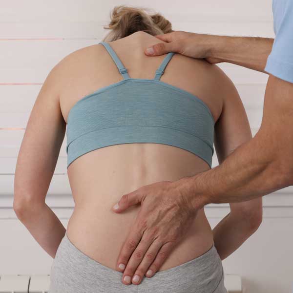 doctor examining spine for decompression from bulging discs