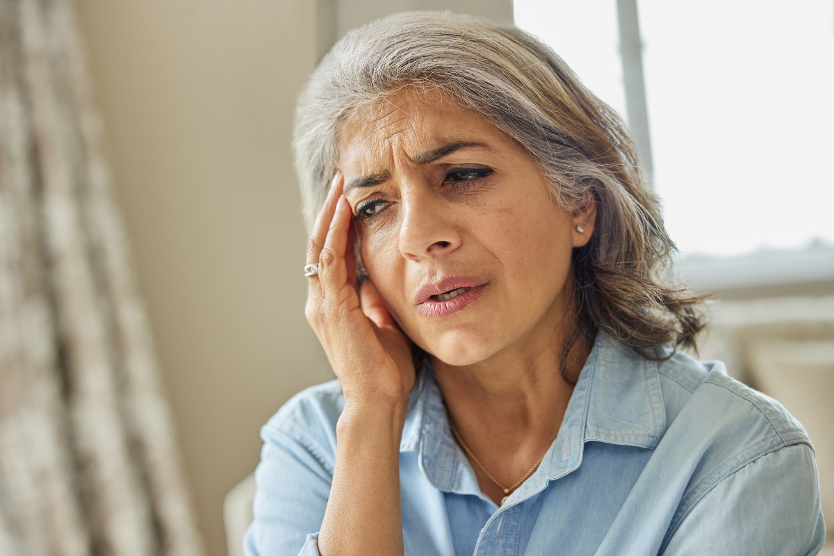 An older woman who seems stressed, as if she has memory issues. 