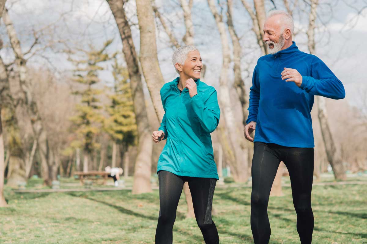 Functional Medicine Approaches for Balancing Hormones and Improving Vitality 3 An older couple going for a jog together outside.